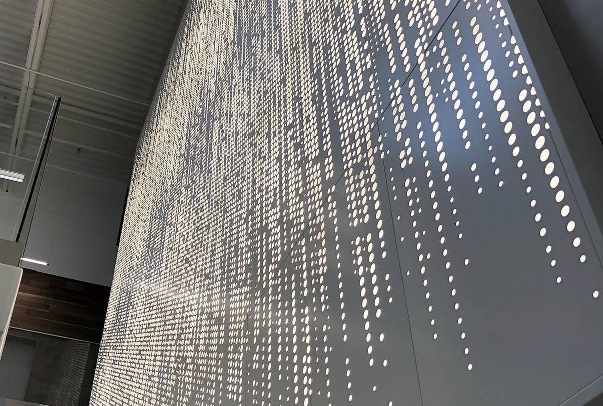 Graphic backlit perforation wall panels