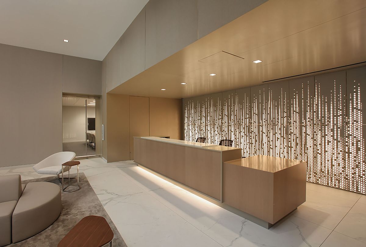 Backlit wall panels in hotel lobby reception area